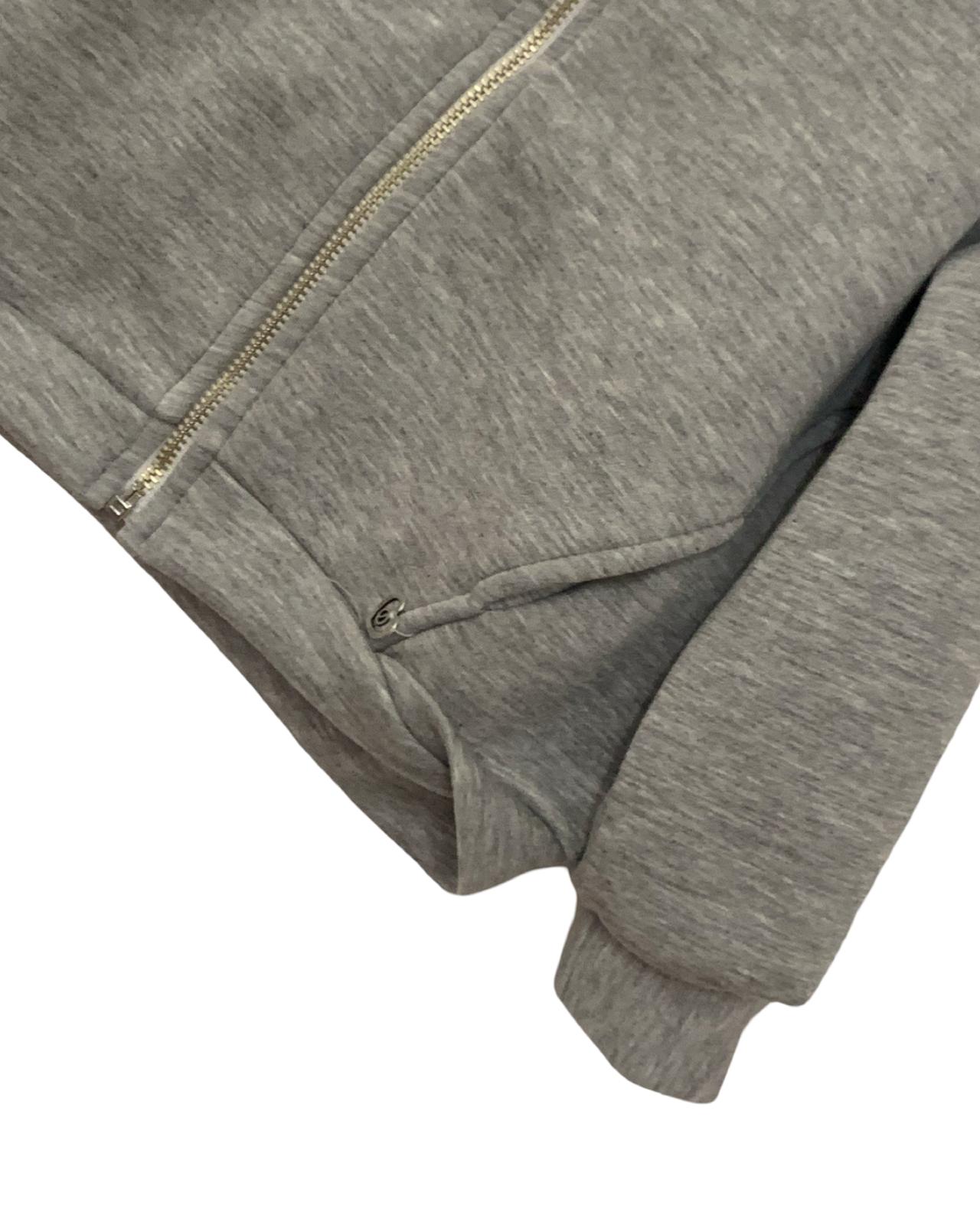 Felpa grigia con cappuccio e zip – comoda e versatile per bambine