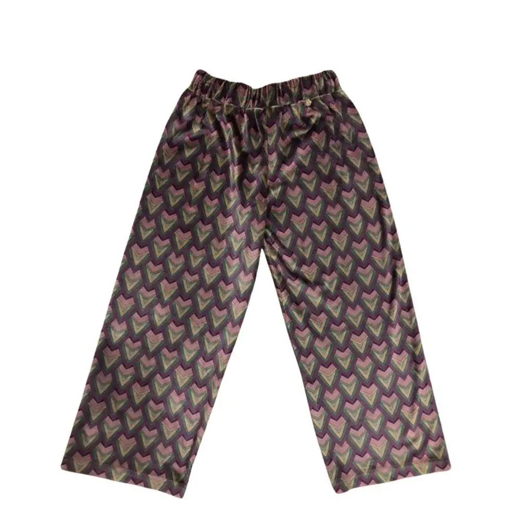 pantaloni larghi ragazza fantasia Paris Hilton con vita elasticata e motivo a cuori geometrici viola e verde
