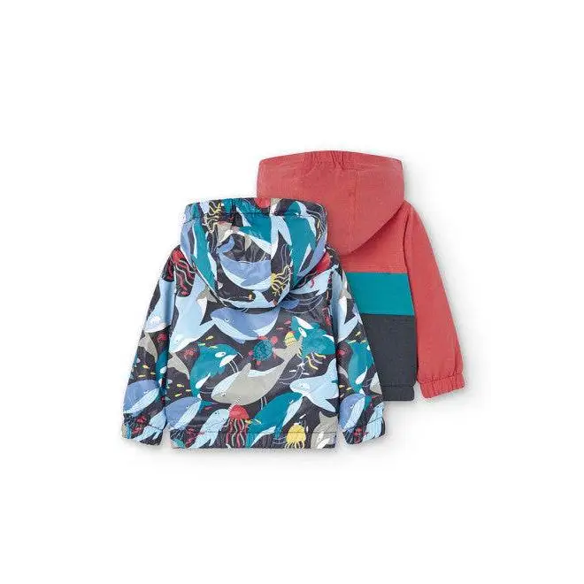 giubbotto reversibile bambino Boboli con cappuccio stampa mare multicolore e lato corallo con banda turchese