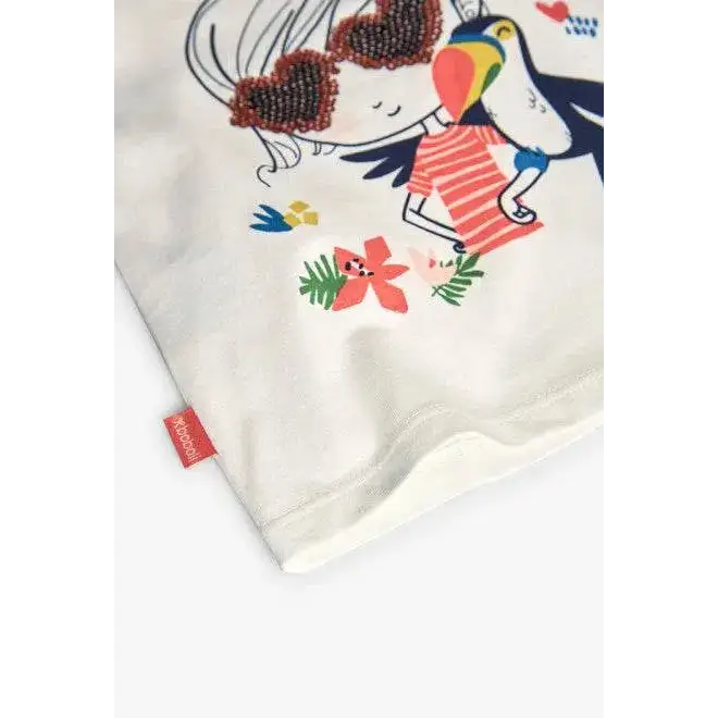 Maglietta bambina Boboli bianca con stampa colorata di bambina e pappagallo con occhiali a forma di cuore