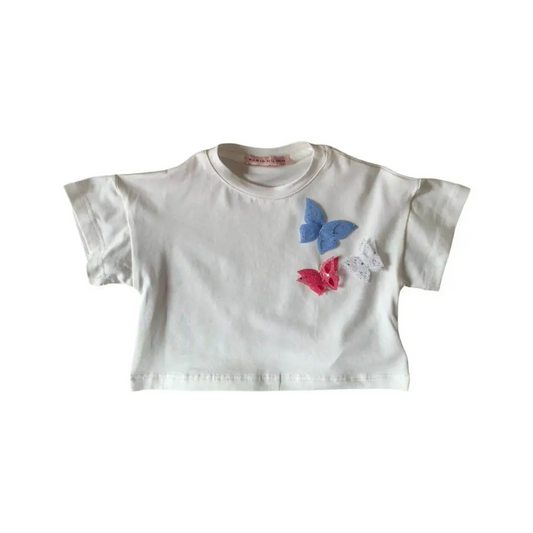 maglietta corta bambina Paris Hilton in cotone bianco con applicazioni farfalle rosa e azzurre maniche corte