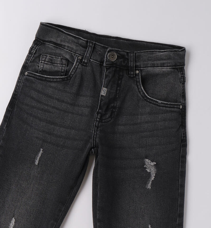 Jeans ragazzo Sarabanda in denim nero con strappi e dettagli alla moda