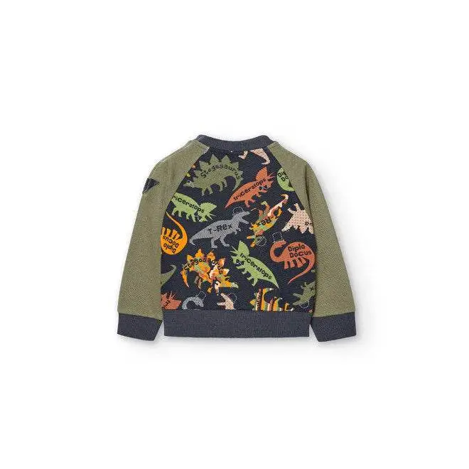 Felpa dinosauri bambino Boboli con stampa colorata di dinosauri sul retro maniche raglan verde oliva e bordi blu navy
