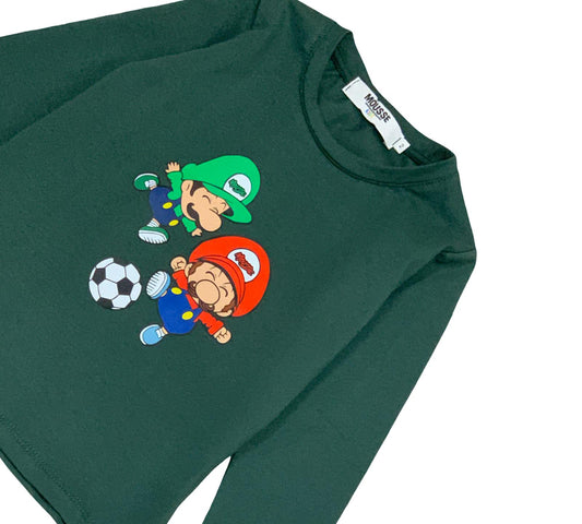 Maglietta bambino verde stampa divertente con personaggi che giocano a calcio