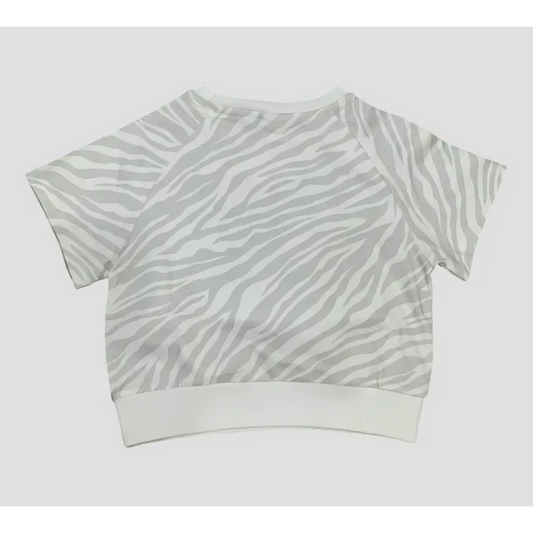 Maglietta ragazza Freddy bianca con stampa a righe zebrato grigio chiaro e collo morbido