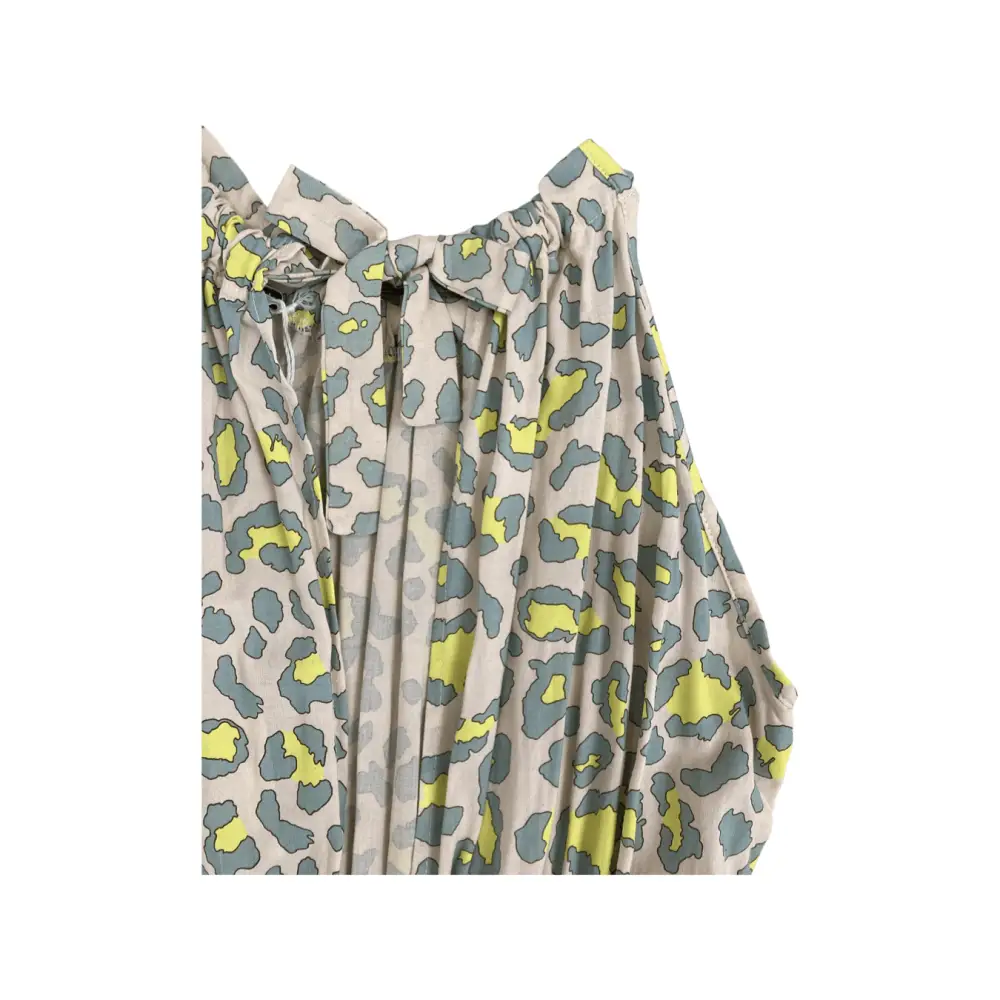 Pantalone in tessuto fluido con stampa maculata beige grigio e giallo, vita con coulisse e volant, tuta maculata bambina Yclù