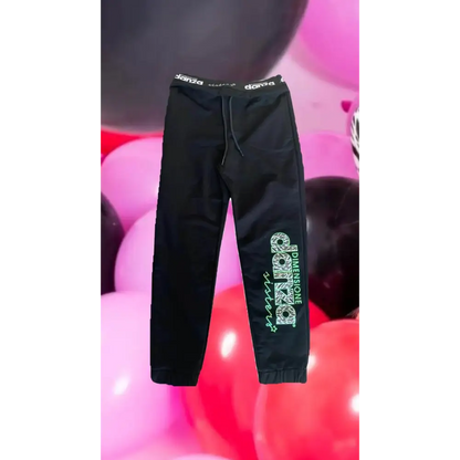 pantaloni ragazza Dimensione Danza neri in felpa con vita elastica coulisse e stampa verde sulla gamba