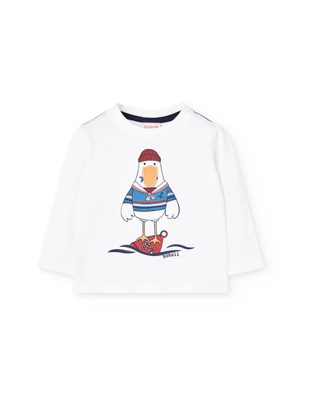 Maglietta bambino bianca stampata con un'anatra in maglione e scarpe da sci per un look divertente