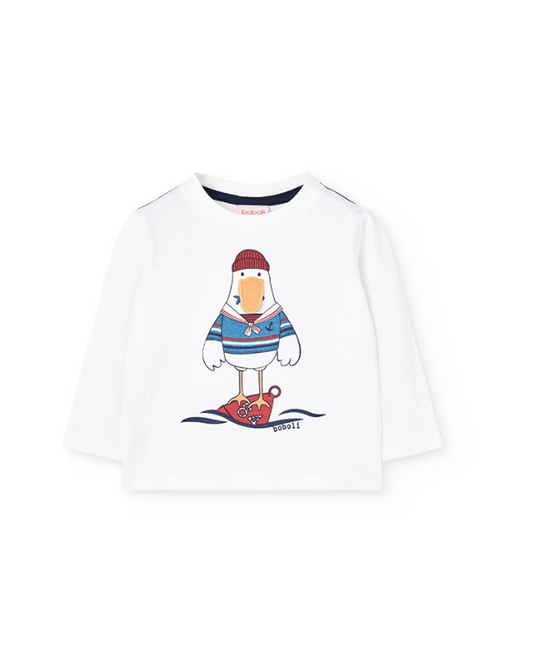 Maglietta bambino bianca stampata con un'anatra in maglione e scarpe da sci per un look divertente