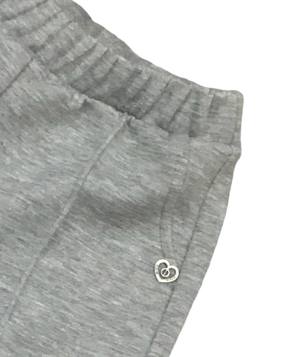 Pantalone baggy grigio melange bambina con elastico e polsini dettaglio vita e decorazione cuore