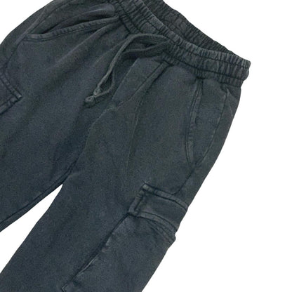 Pantaloni sportivi neri ragazzo con vita elastica e tasche laterali per un look casual